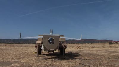 Archive rear view of a ScanEagle on its trailer-mounted rail launcher at Camp Roberts in 2015.