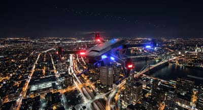 Tactical police drone with Starlink connectivity over nighttime cityscape